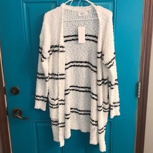White cardigan with black stripes